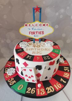 a casino themed birthday cake with the words welcome to texas forties on it's top