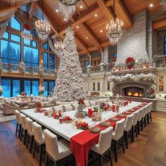 a large dining room with a christmas tree in the center