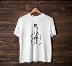 Are you looking for a gift for a musician or for yourself? Then this guitar design could be just right for you. About the T-shirt: The unisex T-shirt in soft style sets a new accent on casual comfort. The T-shirt is made of very soft material and consists of 100% cotton for plain T-shirts. Heather colors and sports gray contain polyester. The shoulders have a twill band for better durability. There are no side seams. The collar is provided with ribbed knit to prevent curling. - 100% ring-spun cotton (fiber content may vary in different colors) - Lightweight fabric (4.5 oz/yd² (153 g/m - Eurofit - Tear-off label - True to size -On the left side of the shoulder is the logo of Elia D'Ambrosio (profile picture) White Music-themed T-shirt With Band Logo, Plain T Shirts, Treble Clef, Guitar Design, Plain Tshirt, Soft Style, Fashion Set, Soft Material, Cotton Fiber