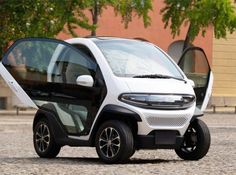 an electric car is parked on the street