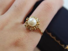 -Antique 18k Gold Natural Diamond with Round Pearl Ring -Ring size: 6 US -Pearl size: 7 mm -Diamond size: 3 mm -Total weight: 3.3 g -Marked 750 -Total of 6 diamonds Elegant 14k Gold Pearl Ring With Halo Setting, Formal 14k Gold Pearl Ring With Halo Setting, Formal Gold Pearl Ring With Halo Setting, Formal Yellow Gold Pearl Ring With Halo Setting, Classic Gold Pearl Ring With Halo Setting, Pretty Rings, New City, Jewellery Designs, Simple Jewelry