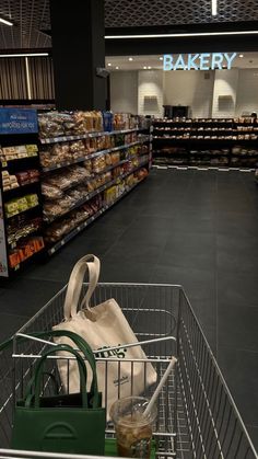 an empty shopping cart in a grocery store