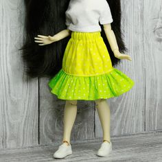 Cool Blythe ruffle yellow and green skirt with white polka dot. 100% cotton 🌸 Inverted version of this skirt is also available 🌸 https://www.etsy.com/listing/1455029360/blythe-ruffle-skirt-green-and-yellow Skirt fits both joint and non-joint body. Skirt is intended for a 12 inch Blythe doll. Fits on Neo Blythe, Licca, Pullip, Azone. Please note that this listing is for the doll SKIRT ONLY. Doll, other clothing and accessories are not included. Product color may be slightly different due to lig Playful White Skirt With Ruffles, Playful Green Skirt For Spring, Green Cotton Ruffled Bottoms, Green Tiered Ruffle Skirt, Green Tiered Skirt With Ruffles, Green Cotton Tiered Skirt, Yellow Ruffled Cotton Bottoms, Yellow Cotton Ruffled Bottoms, Green Mini Skirt With Ruffles