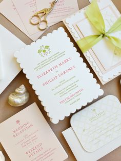 the wedding stationery is laid out on the table