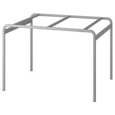 a white metal frame on top of a table with two legs and one leg extended