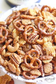 a white bowl filled with cheetos and pretzels