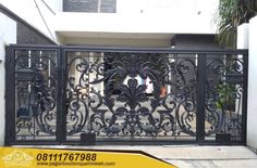 an iron gate in front of a house