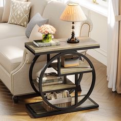 a living room scene with focus on the end table and bookshelf near the couch