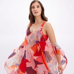 Lively With Its Playful Patterns, This Frank Lyman Dress Is A Stunning Choice. It Features A Plunging Neckline And Exposed Shoulders, All Held Together By A Sheer, Chiffon Cape. Drapey And Elegant, This Stunning Choice Is An Undeniably Appropriate Choice For The Summer Season. 246142 100% Polyester No Pockets No Zipper Our Model Is 5'9"/175 Cm And Wears A Size 6. Approximate Length (Size 12): 41" - 104 Cm Silk V-neck Beachwear Dress, Beachwear Silk Dress With Floral Print, Silk Summer Beachwear Dresses, Pink Silk A-line Midi Dress, Pink Fitted Beachwear Dress, Pink Silk V-neck Party Dress, Fitted Pink Beachwear Dress, Pink A-line Beach Dress, Red Silk Summer Dress