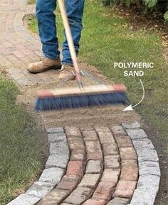 a man is shoveling bricks in the yard