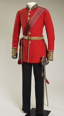 a red uniform with gold trim and two swords