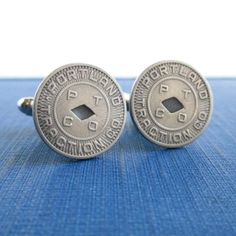 "A pair of cuff links that I made with original vintage Portland, OR transit tokens.  They are 5/8\" in diameter, silver tone and read PORTLAND TRACTION CO.  These tokens were first used in 1930.  I used silver tone cuff link backs encased in a two-part epoxy.  They will come in a new gift box and this will be the exact pair you receive.  Please let me know if you need more than one pair.  I also have other Portland token jewelry in my shop: www.etsy.com/shop/lucra?ref=shop_sugg&search_query=por Vintage Engraved Collectible Cufflinks, Vintage Silver Engraved Cufflinks, Vintage Silver Cufflinks For Wedding, Vintage Silver Wedding Cufflinks, Vintage Stamped Jewelry For Formal Occasions, Vintage Formal Jewelry With Stamped Details, Vintage Collectible Cufflinks, Repurposed Vintage, Tie Tack