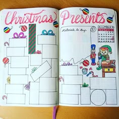 an open christmas planner is shown on a wooden table with a pen and pencil in it