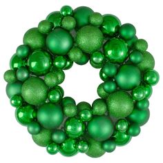 a green christmas ornament on a white background