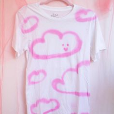 Hand painted white t-shirt with pink textile spray paint. Limited quantities!!! Each t-shirt is unique with a different pattern of random clouds. Image (small) for reference, the tee you'll receive may be different!



Size chart
Little

Medium
Big
Very large
TT big
TTT big


Width (in)
18

20

22

24

26

28


Height    (in)
28

29

30
31

32

33 Painted Clouds, Paint T Shirt, Pink Textile, Puffy Paint, Different Patterns, White T Shirt, White Painting, Spray Paint, White T