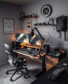 a computer desk with two monitors on top of it