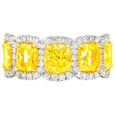 Magnificent Fancy Yellow diamond diamond band, features 5.50 Carats of Fancy color Yellow Cushion Cut Diamonds, surrounded by 1.20 Carats of white round brilliant cut diamonds. Each stone is approximately 1.00 carat (plus) cushion cut. Each stone certified by GIA Beautiful vibrant yellow color! Yellow Diamond Jewelry, Contemporary Wedding Rings, Yellow Diamond Earring, Eternity Band Set, Gold Eternity Band, Yellow Cushion, Diamond Eternity Ring, Fancy Yellow Diamond, Diamond Eternity Band