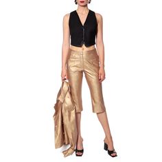 A knee-length pants made of soft vegan leather in gold colour. With side pockets. Fastened with a zipper. Wear them with the jacket Collins Gold. Please refer to the detailed table of our sizes and our detailed measurements which you can find in the Sizing tab for the best fit. Protective washing at 15 °C with delicate detergents Spin lightly Iron at 110 °C on the left side through the protective pad  COMPOSITION: VEGAN LEATHER: 50% Polyurethane, 50% Viscose Gold Fitted Knee-length Bottoms, Chic Gold Bottoms For Workwear, Chic Gold Bottoms For Work, Chic Gold Pants For Workwear, Gold Party Bottoms With Pockets, Knee Length Pants, August Birthstone Jewelry, July Birthstone Jewelry, Gifts For New Mums