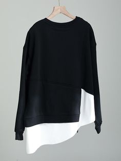 This is perfect for those who are looking for a clothing for a good price. It is fashionable, stylish, and it will look great on anyone who wears it. Do you wanahavit? Oversized Color Block Black Tops, Black Oversized Top With Contrast Color, Oversized Black Top With Contrast Color, Trendy Black Patchwork Sweatshirt, Oversized Black Patchwork Tops, Black Patchwork Tops For Layering, Trendy Black Color Block Sweatshirt, Cotton Top With Patchwork And Asymmetrical Hem, Oversized Long Sleeve Tops With Splicing