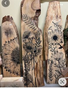 some wood carvings with flowers painted on them