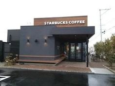 the starbucks is located on the side of the street