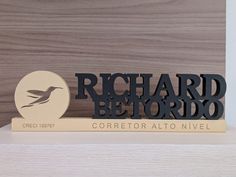 a bookend with a bird on it and the words richard b elordo