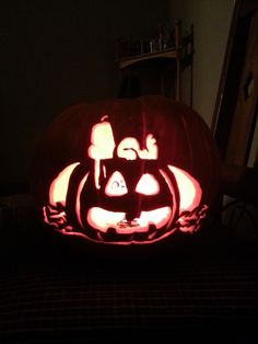 a pumpkin carved to look like a cat