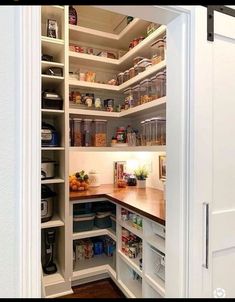 an open pantry with lots of food in it