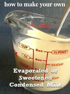 a glass measuring cup filled with liquid on top of a table