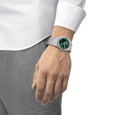 In 1978 the Tissot PRX timepiece was born and today we celebrate it's comeback. The new Tissot PRX is the watch for those with passion for design and an eye for ingenuity. Features include a dark green dial with silver-tone markers and hands and date window at 3 o'clock. The quartz movement is protected by a scratch-resistant sapphire crystal set in a 40mm round stainless steel case. The stainless steel bracelet is secured with a push-button deployment clasp and the watch is water-resistant to 100 meters. Style # T1374101109100. Formal Green Watch Accessories With Date Indicator, Round Dial Watch With Date Indicator As Gift, Watches With Date Indicator And Round Dial As Gift, Green Chronograph Watches For Formal Occasions, Modern Quartz Watches For Anniversary, Modern Watches With Date Indicator As Gift, Modern Anniversary Watches With Metal Dial, Modern Watch Accessories With Subdials For Anniversary, Modern Green Watches With Date Indicator