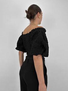 A fun, versatile puff sleeve top, featuring voluminous sleeves, a flattering V-neckline, and flutter trim. The fully smocked elastic throughout ensures a comfortable, yet fitted true-to-size fit that can be worn on or off the shoulder. With its slightly cropped design, this top is perfect for pairing with high-waisted trousers or skirts. Self: 100% Cotton.Lining: 100% Cotton. Connor is wearing size Small. Refer to our Size Chart for Model Measurements. Questions about fit? Text us anytime! 614-3 Voluminous Sleeves, Smocked Top, Puff Sleeve Top, High Waisted Trousers, Model Measurements, Smocking, Puff Sleeve, Off The Shoulder, Sleeve Top