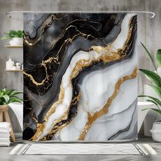 a shower curtain with black, white and gold marble design on it in a bathroom