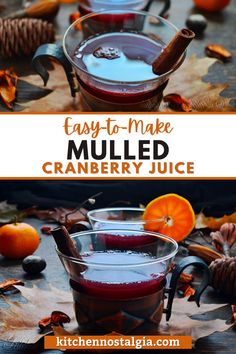 two glasses filled with mulled cranberry juice on top of leaves and oranges