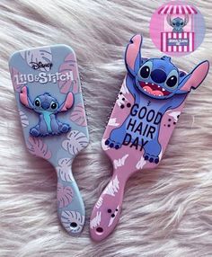 two toothbrushes with cartoon characters on them