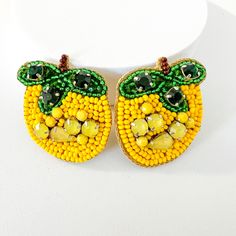 Get these amazing Bumblebee earrings! Bright, eye-catching beads with exquisite detailing, embellished with rhinestones. 🖤Please visit our store to see the rest of our designs. 🖤She'll feel distinguished wearing these handcrafted earrings. 🖤All of them come packaged as gifts, making them ideal presents. 🖤Furthermore, they are lightweight! Send me a message for bulk pricing 🖤Shipping is quite quick; most orders are shipped the same day. 🖤First-class service will be provided. Please upgrade your shipping service if you need the order in 2-3 days! Please check your address again to prevent delays and missed deliveries. Yellow Dangling Beads Earrings For Party, Yellow Earrings With Large Round Beads, Yellow Dangle Earrings With Large Beads, Yellow Dangle Earrings With Faceted Beads, Handmade Yellow Earrings For Party, Yellow Round Bead Earrings For Party, Yellow Drop Earrings With Colorful Beads, Unique Yellow Beaded Earrings For Pierced Ears, Unique Yellow Beaded Earrings With Round Beads