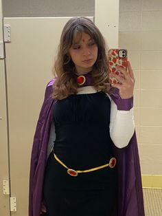 a woman dressed in costume taking a selfie