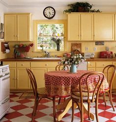 a kitchen with yellow cabinets and checkered flooring on the floor is shown in this image