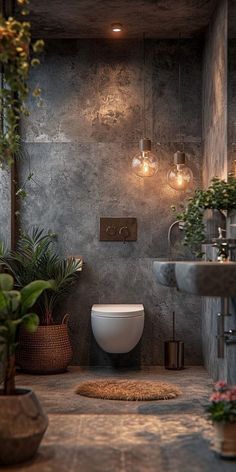 a bathroom that has plants in the corner and lights on above it, along with a round rug