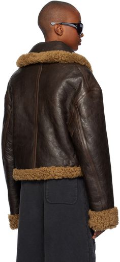 Reversible grained lambskin jacket. Shearling trim throughout. Reverse in brown shearling. · Spread collar · Zip closure · Welt pockets · Cropped hem · Patch pockets and pin-buckle tabs at interior Supplier color: Brown Brown Shearling Fur Coat For Work, Brown Shearling Leather Jacket With Padded Collar, Brown Shearling Outerwear With Padded Collar, Brown Shearling Fur Coat With Padded Collar, Brown Shearling Jacket, Lambskin Jacket, Shearling Jacket, Welt Pockets, Welt Pocket