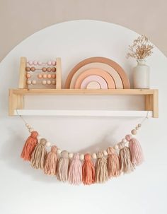 a shelf that has some tassels and plates on it