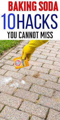 a person in yellow gloves and rubber gloves is cleaning the sidewalk with a sponge on it