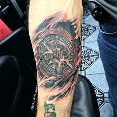 a man with a tattoo on his arm