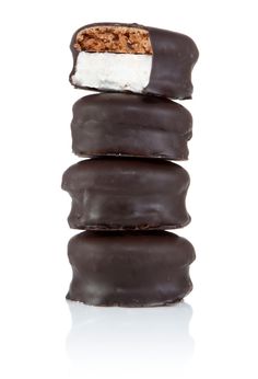 three chocolate covered donuts stacked on top of each other