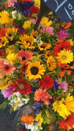 a large bouquet of colorful flowers on display