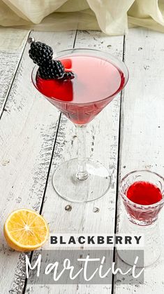 the black berry martini is garnished with an orange slice