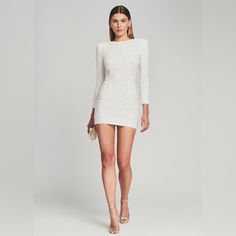 New With Tags. No Shoulder Pads For Better Fit. Take On The Night In Our Nikki Dress! Crafted With Hand-Embroidered Sequins, This Sleek And Sultry Design Features A Round Neck, Fitted Quarter-Length Sleeves And An Ultra-Short Hemline. The Style Is Finished With An Invisible Back Zip Closure. Shown Here In White. Handmade 100% Nylon, Sequins Made In India Tags: Bridal Sequins, Sequins Dress, Engagement Dress, Engagement Photos, Wedding Dress, After Party Dress, Revolve Dress White Fitted Sequin Dress For Gala, Long Sleeve Evening Mini Dress For Wedding, White Sequin Mini Dress For Formal Occasions, Formal White Sequined Mini Dress, Formal White Mini Dress With Sequins, White Long Sleeve Evening Dress, White Holiday Mini Dress, White Evening Wedding Mini Dress, White Embellished Dinner Dress