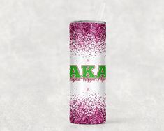 a pink and white tumbler cup with the word aka on it's side