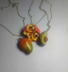 Keep Jamaica & your favourite Jamaican food close to your heart with these stainless steel & polymer clay necklaces.  Ackee charm is 1 inch long, 1 inch wide. Mango charm is 1 inch long, 3/4 inches wide. Pear charm is 1 inch long, 3/4 inches wide. Necklaces have lobster clasp closure. Clay Necklaces, Jamaican Food, Apple Earrings, Claw Necklace, Jamaican Recipes, Polymer Clay Necklace, Clay Necklace, Charm Necklaces, Buying Gifts