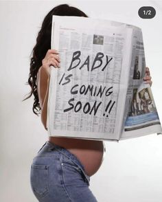 a pregnant woman holding up a newspaper with the words baby is coming soon written on it