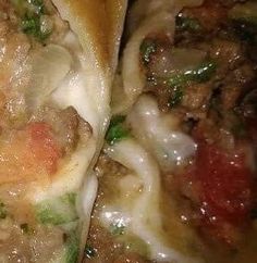 closeup of some food with meat and cheese